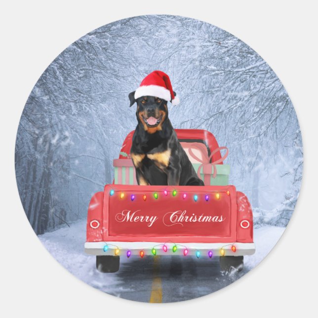 Sticker Rond Dog Rottweiler en neige assis sur un camion de Noë (Devant)