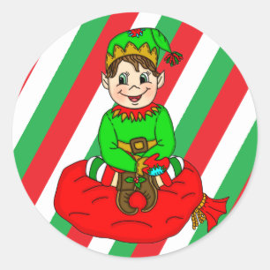 Sticker Rond Elfe de Noël assis sur le sac de jouets Père No