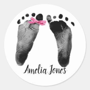 Sticker Rond Empreintes bébé avec Bow sur blanc