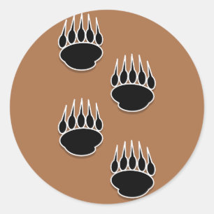 Sticker Rond Empreintes de pattes de l'ours noir sur Terre Arri