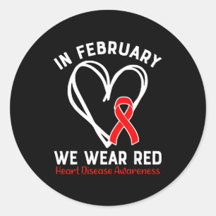 Sticker Rond En février, nous portons un ruban rouge pour la se