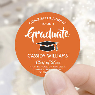 Sticker Rond Félicitations Orange, Blanc et Noir Graduation