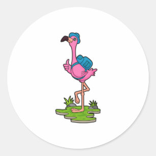 Sticker Rond Flamant rose comme randonneur avec sac à dos