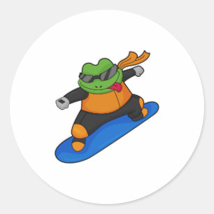 Sticker Rond Grenouille en snowobarder avec snowboard