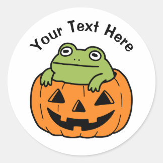 Sticker Rond Grenouille mignonne dans une citrouille d'Hallowee