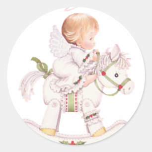 Sticker Rond Joli ange sur un cheval à bascule blanc pour Noël
