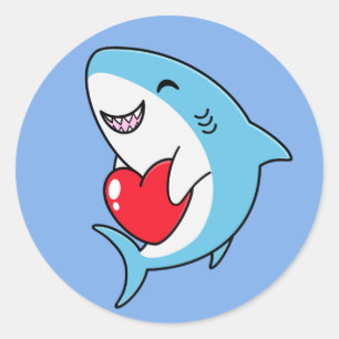 Sticker Rond Joli requin bleu tenant un coeur rouge