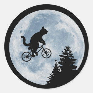 Sticker Rond Le chat fait du vélo sur le arrière - plan de la
