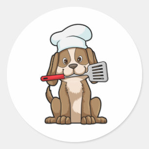 Sticker Rond Le chien cuisinier avec le casquette et la spatule