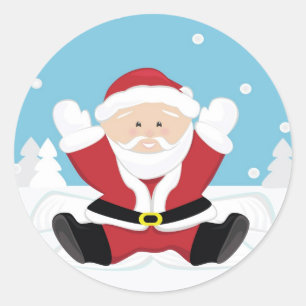 Sticker Rond Le Père Noël joue sur la neige.