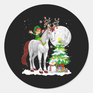Sticker Rond Lutin de Noël chevauchant un renne cheval bonhomme