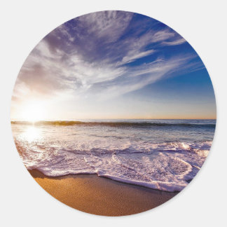 Sticker Rond Ocean Waves reposant sur la plage