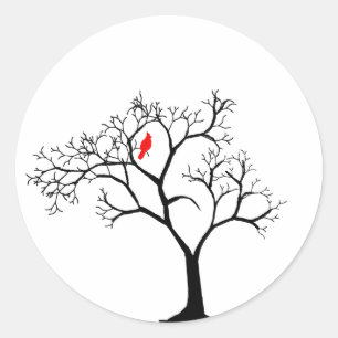 Sticker Rond Oiseau rouge cardinal dans un arbre d'hiver neigeu