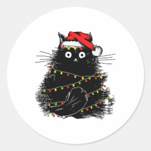 Sticker Rond père Noël chat noir emmêlé à la lumière des arbres