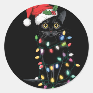 Sticker Rond Père Noël Chat Noir Tangé Dans La Lumière De L'Arb
