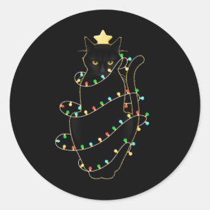 Sticker Rond Père Noël Chat Noir Tangé Dans La Lumière De L'Arb