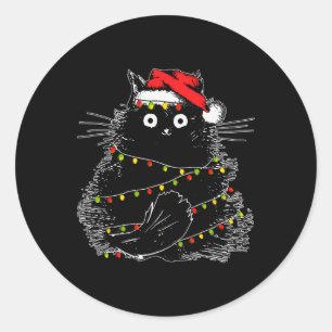 Sticker Rond Père Noël Chat Noir Tangé Dans La Lumière De L'Arb
