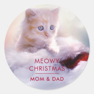 Sticker Rond Petit Kitten reposant sur un chapeau de Noël Meowy