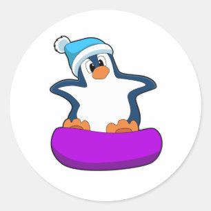 Sticker Rond Pingouin au snowboard avec snowboard