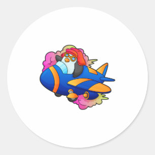 Sticker Rond Pingouin comme pilote avec avion