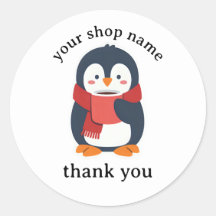 Pingouin sirotant un café chaud avec une écharpe c