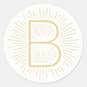 Sticker Rond Rayons brillants d'or de lettre de monogramme d'or
