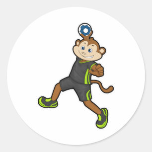 Sticker Rond Singe à Handball joueur avec Handball