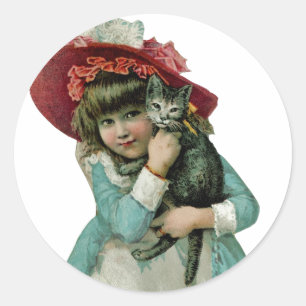 Sticker Rond Tenir un chaton de Noël