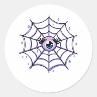 Sticker Rond Un oeil de caricature mignon dans un Web étincelan