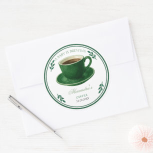 Sticker Rond Une tasse de café "Un bébé est en train de brasser