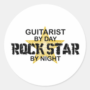 Sticker Rond Vedette du rock de guitariste par nuit
