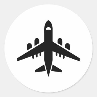 Sticker Rond Vue supérieure silhouette de l'avion volant