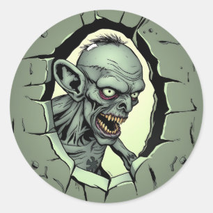 Sticker Rond Zombie en train de sortir du mur Halloween