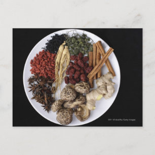 Still life of cinnamon sticks and ginger root postcard