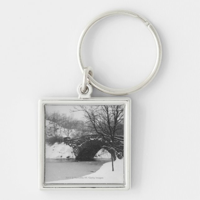 Stone bridge over snow covered river keychain (Front)