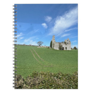 Stone building in green field Irish countryside  Notebook