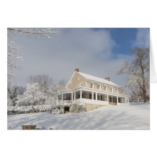 Stone mansion in snow and sunlight