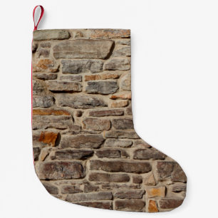 Stone wall rustic texture background small christmas stocking