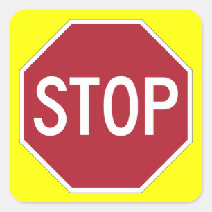 Stop sign on yellow square sticker