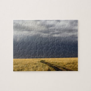 Storm clouds and road across gassy plains of the jigsaw puzzle
