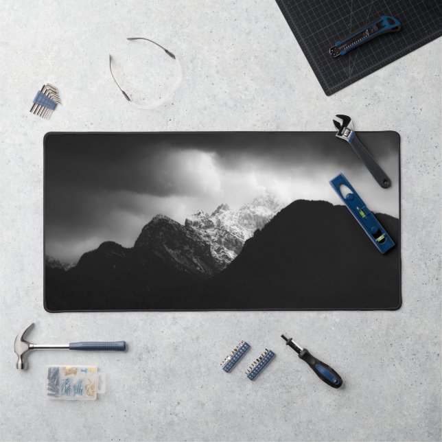 Storm clouds and sun over mountains desk mat (Workstation)