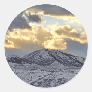 Stormy Sunset Over Snow Capped Mountains Classic Round Sticker