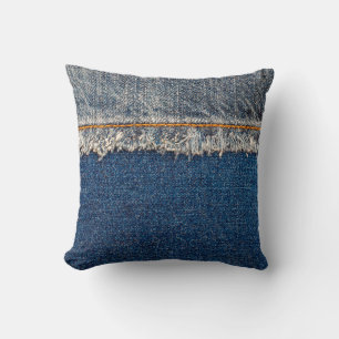 Straight stitch with orange thread on bleached den throw pillow