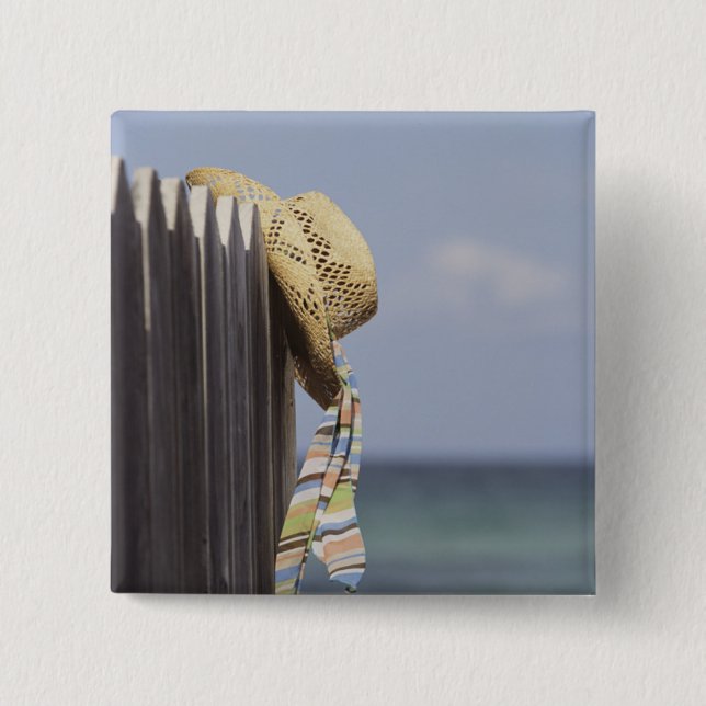 Straw Hat Hanging On Fence At Beach 2 Inch Square Button (Front)
