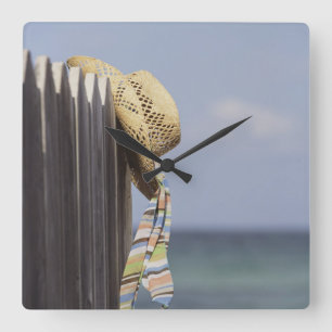 Straw Hat Hanging On Fence At Beach Square Wall Clock