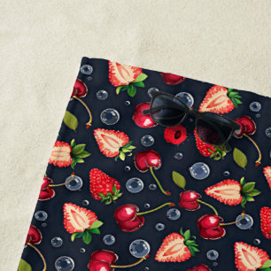 Strawberries and cherries on a dark background beach towel