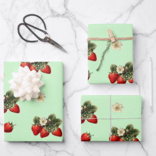 Strawberry wrapping paper with blossoms on green