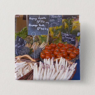 Street market merchant's stall with white 2 inch square button