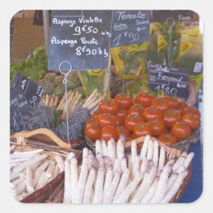 Street market merchant's stall with white square sticker