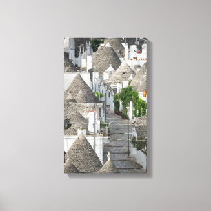 Street with trulli houses in Alberobello, Puglia Canvas Print